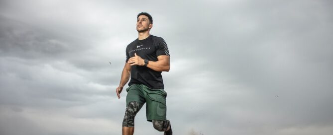 Man performing low-impact exercise in gym attire, demonstrating safe fitness practices for individuals with injuries